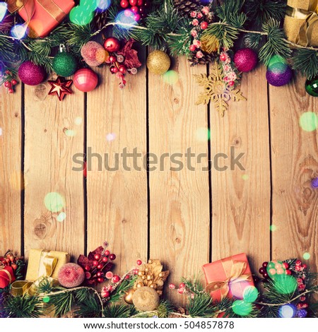Christmas background with decoration on wooden board. Vintage filter effect. View from above