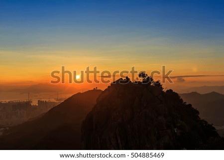 Sunset over black mountains in the fog, Mountain layer background at Hong Kong