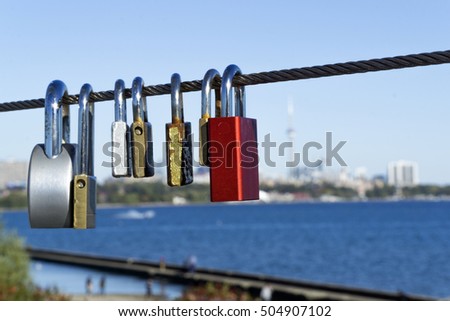 Padlocks hang on steel rope for wishing love or marriage
