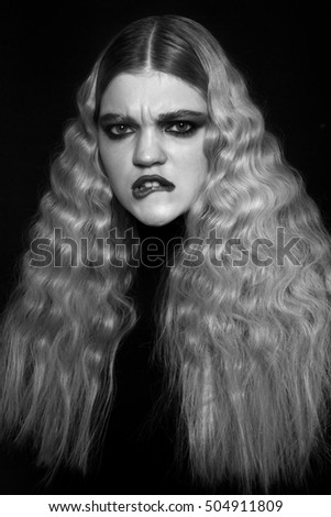 strong woman  , with curly hair on black & white photo