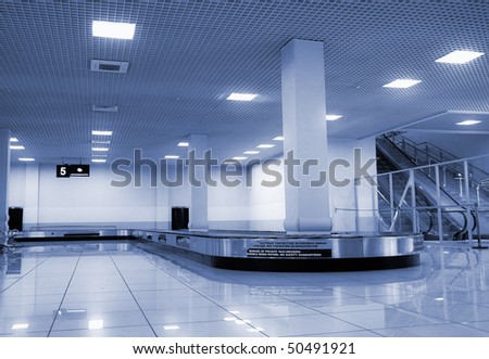 baggage claim area in airport photo