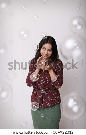 Asian girl on a white background with glass balls