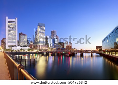 The architecture of Boston in Massachusetts, USA at sunrise showcasing its skyscraper at the Financial District and Harbor.