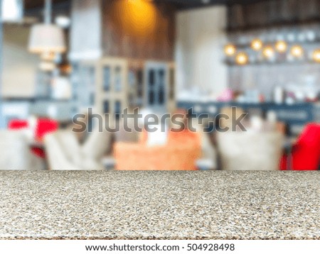Marble board empty table in front of blurred background. Perspective marble table over blur in cafe interior - can be used for display or montage your products. Mockup your products