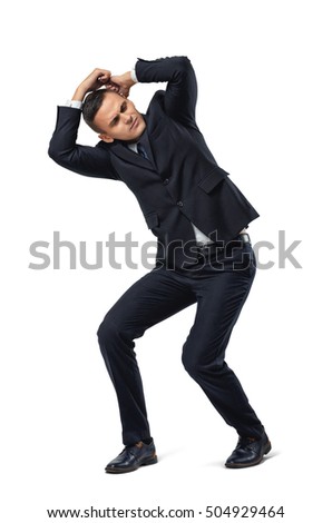 Full length of cut-out businessman protects against pressure from above. Conceptual photo. Problems and issues. Business staff. Protection and defense. Psychological burden and stress.
