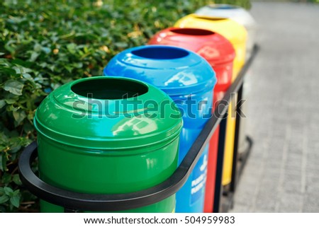Colored trash containers for garbage separation Royalty-Free Stock Photo #504959983