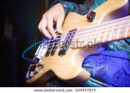 Guitarist plays electric guitar beautiful closeup