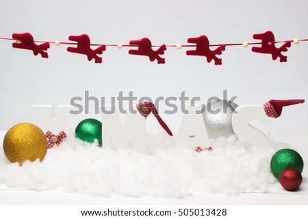Red xmas ornaments on white background. Merry christmas card. Winter holiday theme. Happy New Year. Space for text.