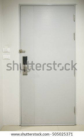 white door is closed in room