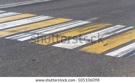 pedestrian crossing stripes on the asphalt