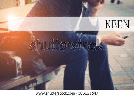 Hand writing KEEN  with the abstract bokeh on background. This word represent the business as concept in stock photo.