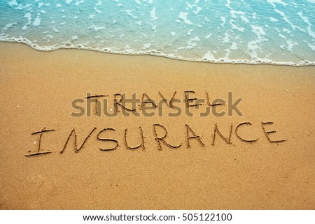 Travel insurance, inscription on sand concept