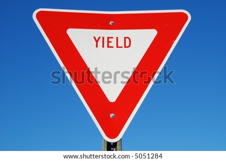 yield sign against blue sky