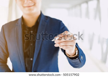 Businessman writing and drawing on the screen
