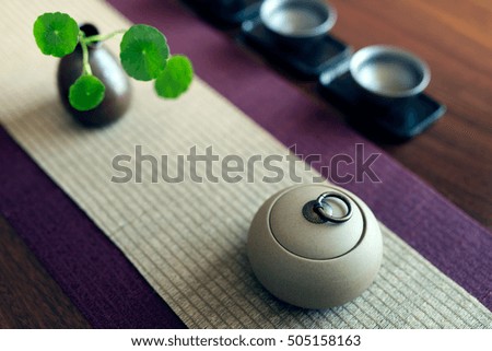 Asian tea set on wooden table