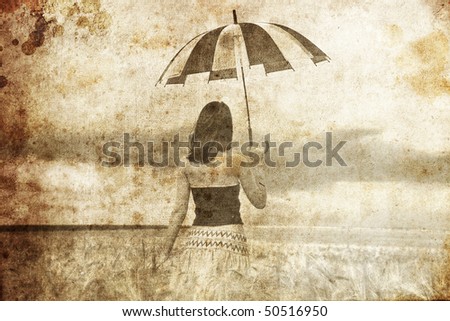 Girl at wheat field with umbrella. Photo in old image style.