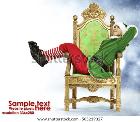 Photo of elf and christmas time background. Image of popular website resolution. 