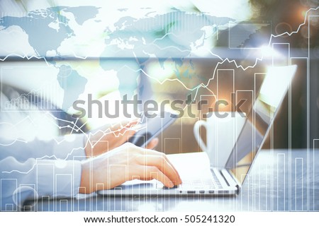 Closeup of businessman using laptop and smartphone with creative business chart and map. Global business concept