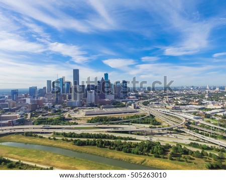 Aerial view Downtown with Interstate 10, 45 and Gulf freeway intersection. Massive highway, stack interchange, viaduct and elevated road junction overpass from Northeast side of Houston, Texas, USA.