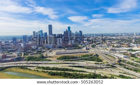 Panoramic aerial view Downtown with Interstate 10, 45 and Gulf freeway intersection. Massive highway, stack interchange, viaduct and elevated road junction overpass from Northeast Houston, Texas, USA.