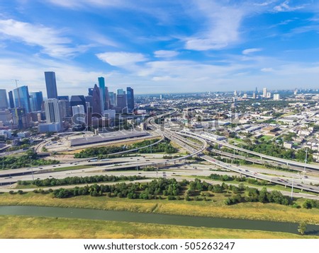 Aerial view Downtown with Interstate 10, 45 and Gulf freeway intersection. Massive highway, stack interchange, viaduct and elevated road junction overpass from Northeast side of Houston, Texas, USA.