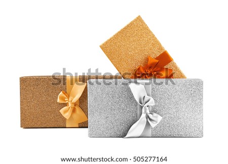 Christmas gifts in shining boxes isolated on white