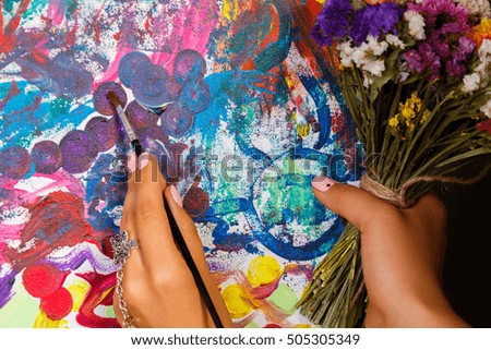The artist paints a picture
