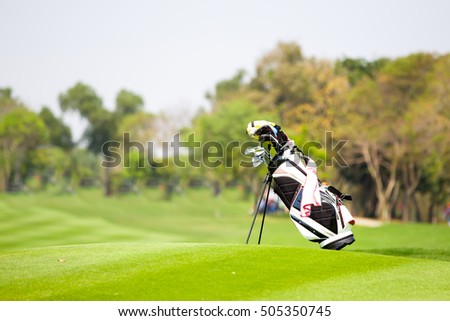 Golf bag, Golf clubs in golf bag on the fairway. Royalty-Free Stock Photo #505350745