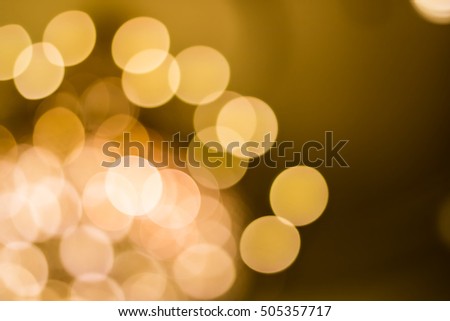 Blur orange background,Gold abstract bokeh background,Golden blurred bokeh lights on black background. Glitter sparkle stars for celebrate.
