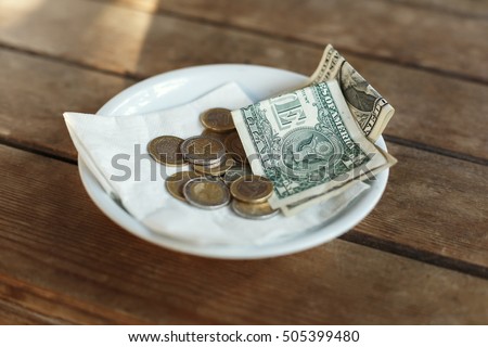 TIPS, Money left on table for server Royalty-Free Stock Photo #505399480