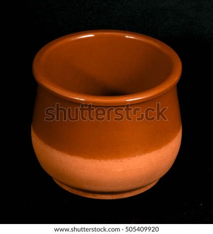 Isolated Clay Pot on Black Background.