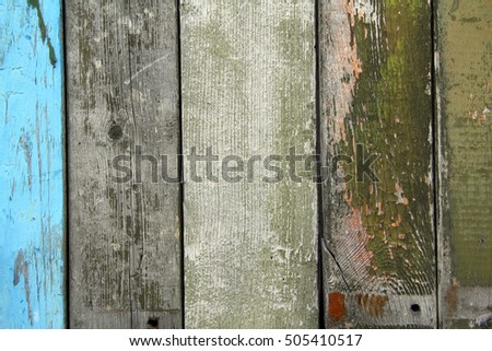 The surface of old wood with traces of old paint. Background texture.