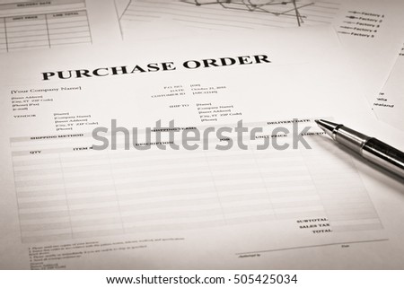 Close up of purchase order form with pen

