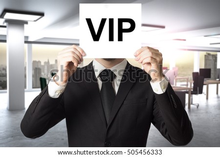 businessman prominence hiding face behind white sign vip