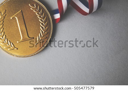 Gold first place winners medal. Success achievement concept Royalty-Free Stock Photo #505477579