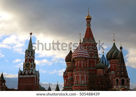 Famous Saint Basil's cathedral and Spasskaya (Savior) Tower on cloudy autumn day