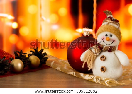 Snowman, red ball, golden balls and cones in Christmas composition.