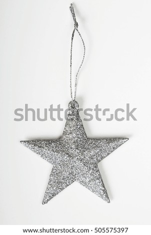 silver star on white wooden background