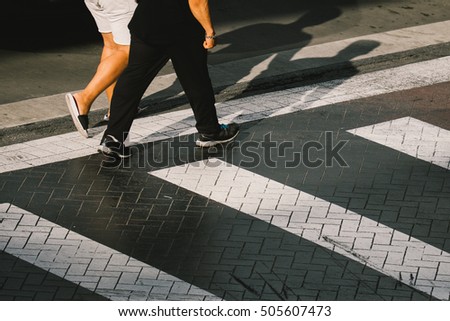People walk on crosswalk. abstract background