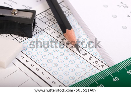 Blank answer sheet with 2B pencil. Answer sheet for testing. Standard school exam answer sheet and pencil. Answer sheet focus on pencil.
