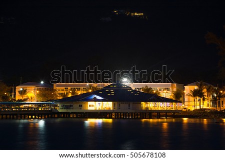 CUSTOMS HOUSE BUILDING AND PUBLIC SEAPORT OFFICE AT KO SAMUI ISLAND ,THAILAND,  SEASIDE CITY IN NIGHT TIME , DARK BACKGROUND