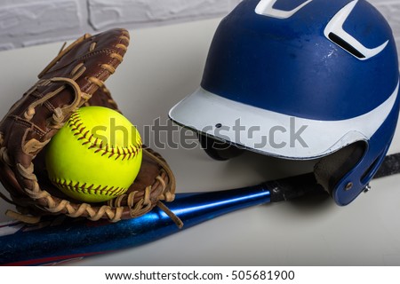 Yellow Softball, Helmet, Bat, and Glove  isolated on white background