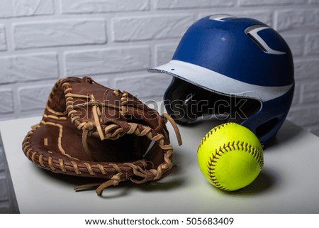 Closeup of a Softball Glove and ball on white background