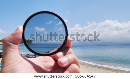Polarizing filter for camera lens in photography Royalty-Free Stock Photo #505684147