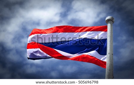 Image of waving Thai flag of Thailand with blue sky background