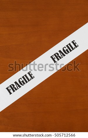 Fragile written on a white strip