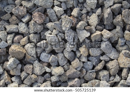 Grey gravel closeup photo for background. Sharp gray stones in pile for construction. Road or building construction supply. Grey stones bunch for wallpaper or banner template. Natural texture picture