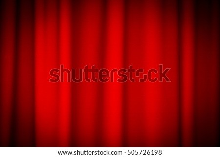 Red curtains on theater or cinema stage with vignetting