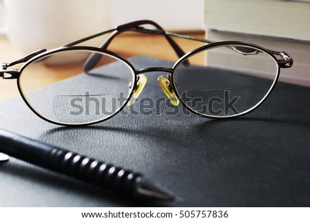 Glasses on the desk in the bedroom.