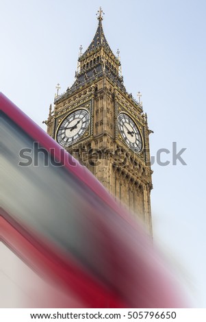 Image of Big Ben (Elizabeth Tower) with a fast moving double-decked bus 
